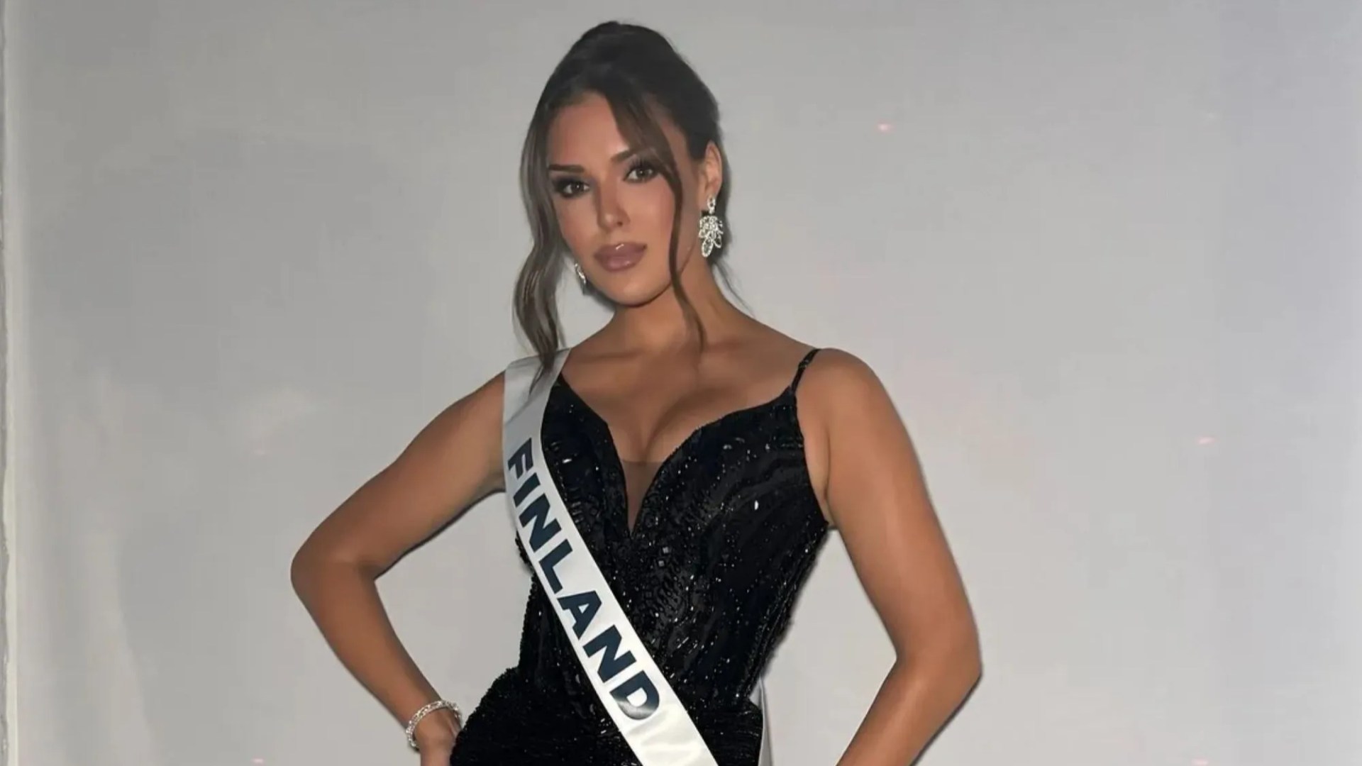 Miss Finland beauty queen is STRIPPED of her title for making disgusting racist gesture in shocking social media pic